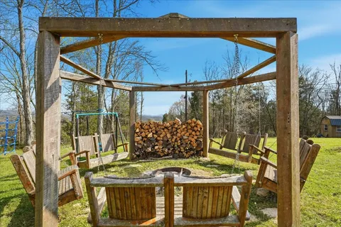 view of a yard with plants and large trees