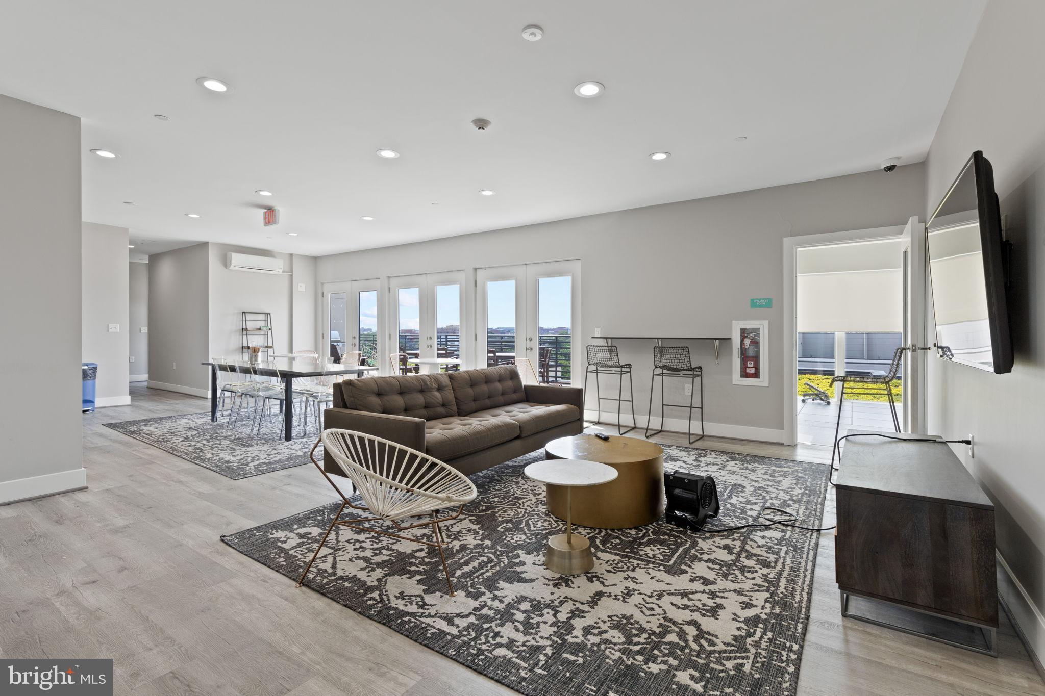 1111 Orren Street Northeast, Unit 207 Washington, DC 20002 - Photo 14 of 21 Spacious modern living area with scenic views.