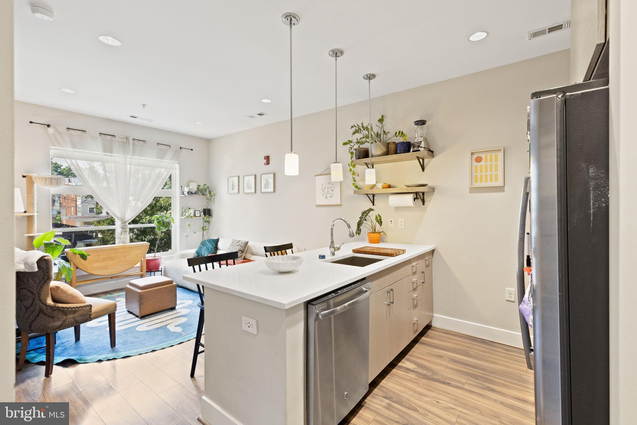1111 Orren Street Northeast, Unit 207 Washington, DC 20002 - Photo 3 of 21 Bright and airy modern kitchen space.