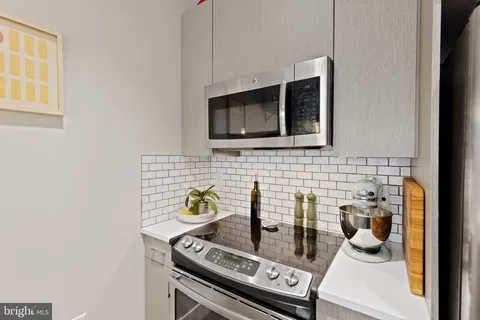 a kitchen with a stove and a microwave