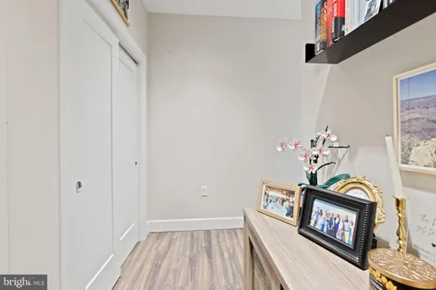 a view of an entryway with wooden floor