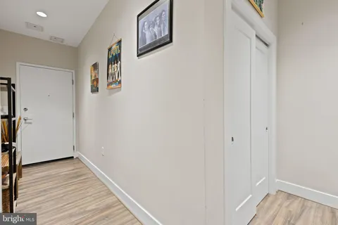 a view of a room with wooden floor