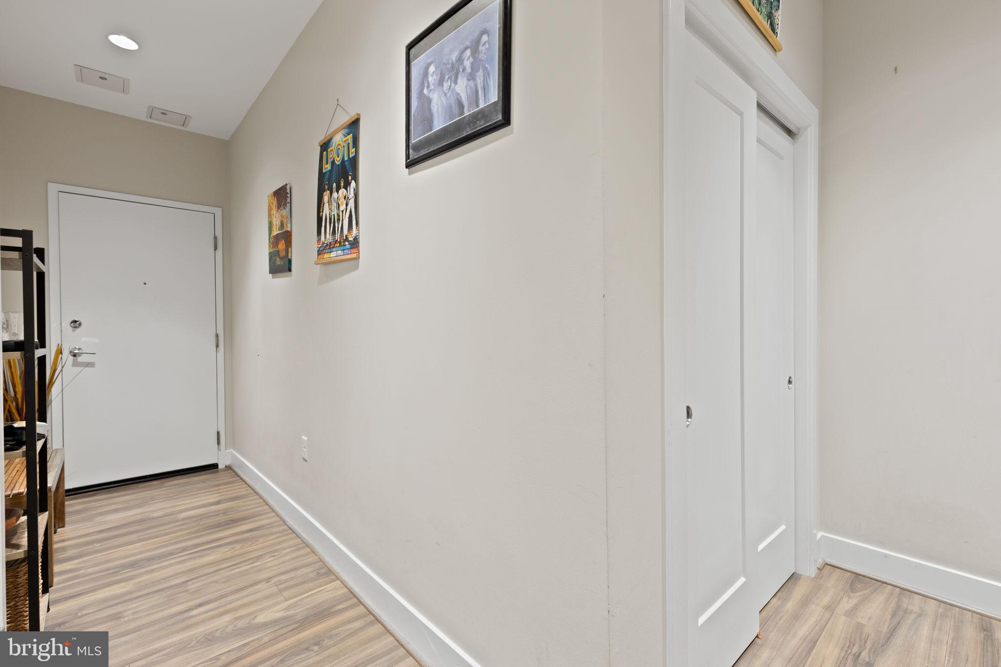 1111 Orren Street Northeast, Unit 207 Washington, DC 20002 - Photo 10 of 21 Inviting hallway with artistic flair.