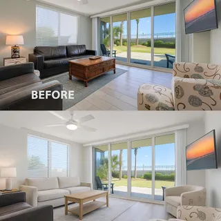a living room with furniture and large windows