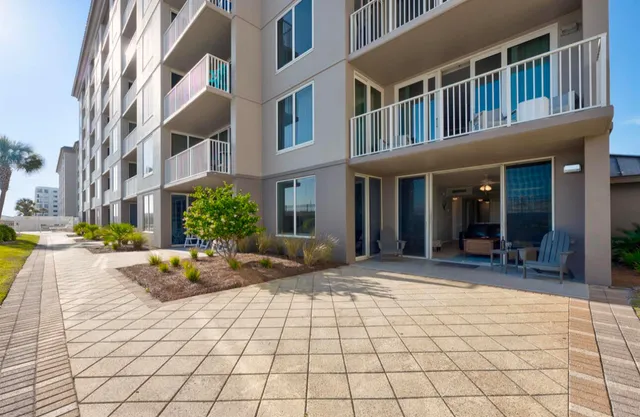 a lobby with furniture and a rug