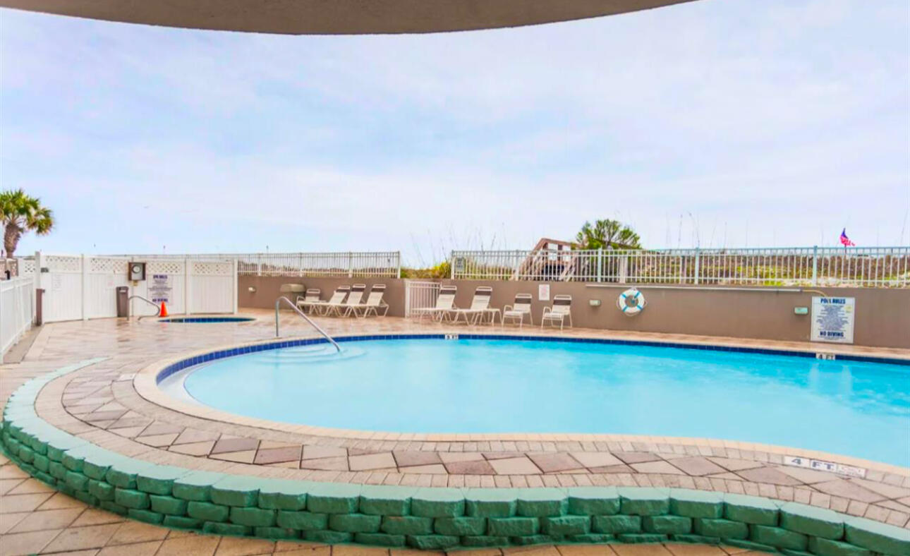 520 Santa Rosa Boulevard, Unit 100 Fort Walton Beach, FL 32548 - Photo 23 of 28 a view of a swimming pool with an ocean view