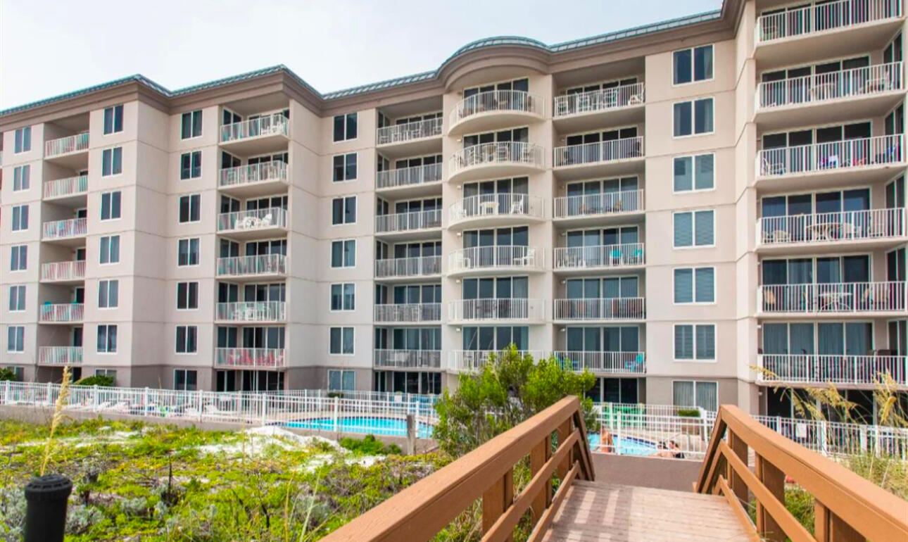 520 Santa Rosa Boulevard, Unit 100 Fort Walton Beach, FL 32548 - Photo 27 of 28 a front view of a building with a swimming pool