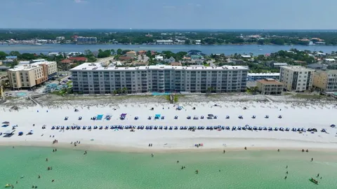 a kitchen with stainless steel appliances a sink and a refrigerator