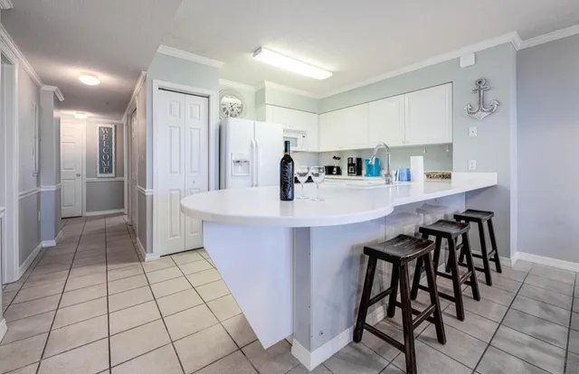 a view of living room with granite countertop furniture and a large mirror