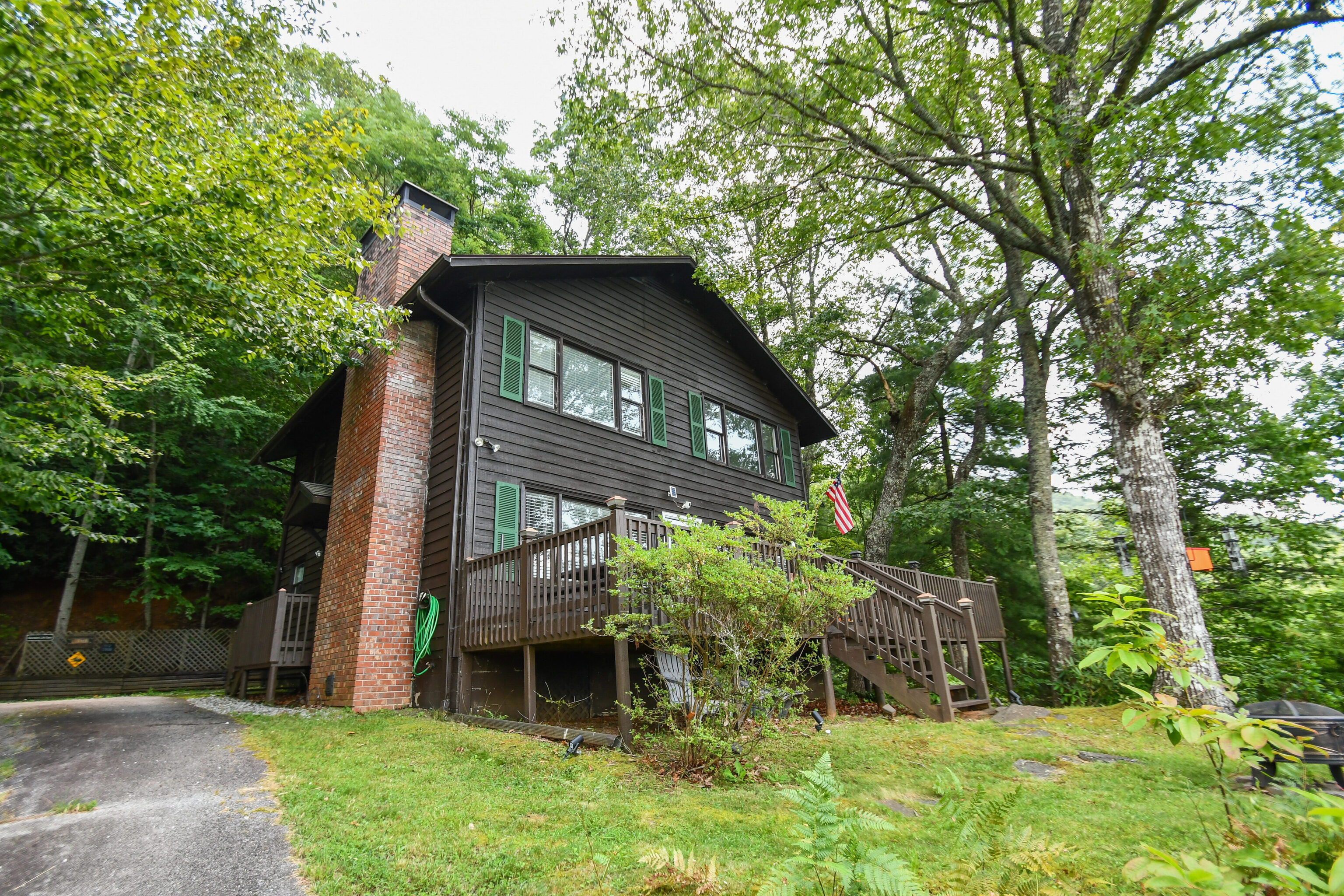 1546 Black Branch Road Rabun Gap, GA 30568 - Photo 1 of 1 a view of a house with a yard