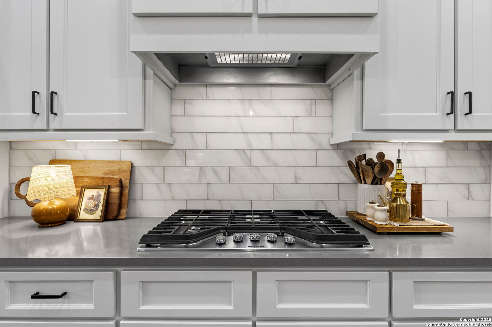 71 Sabinas Creek Ranch Road Boerne, TX 78006 - Photo 13 of 38 a stove top oven sitting inside of a kitchen