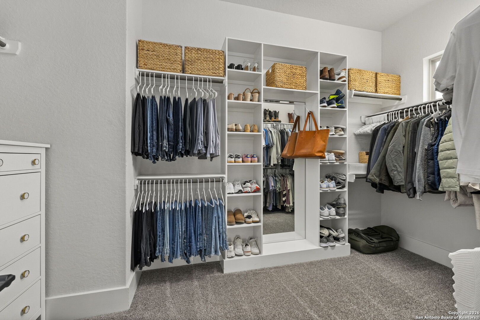 71 Sabinas Creek Ranch Road Boerne, TX 78006 - Photo 18 of 38 a view of walk in closet with clothes and shoes