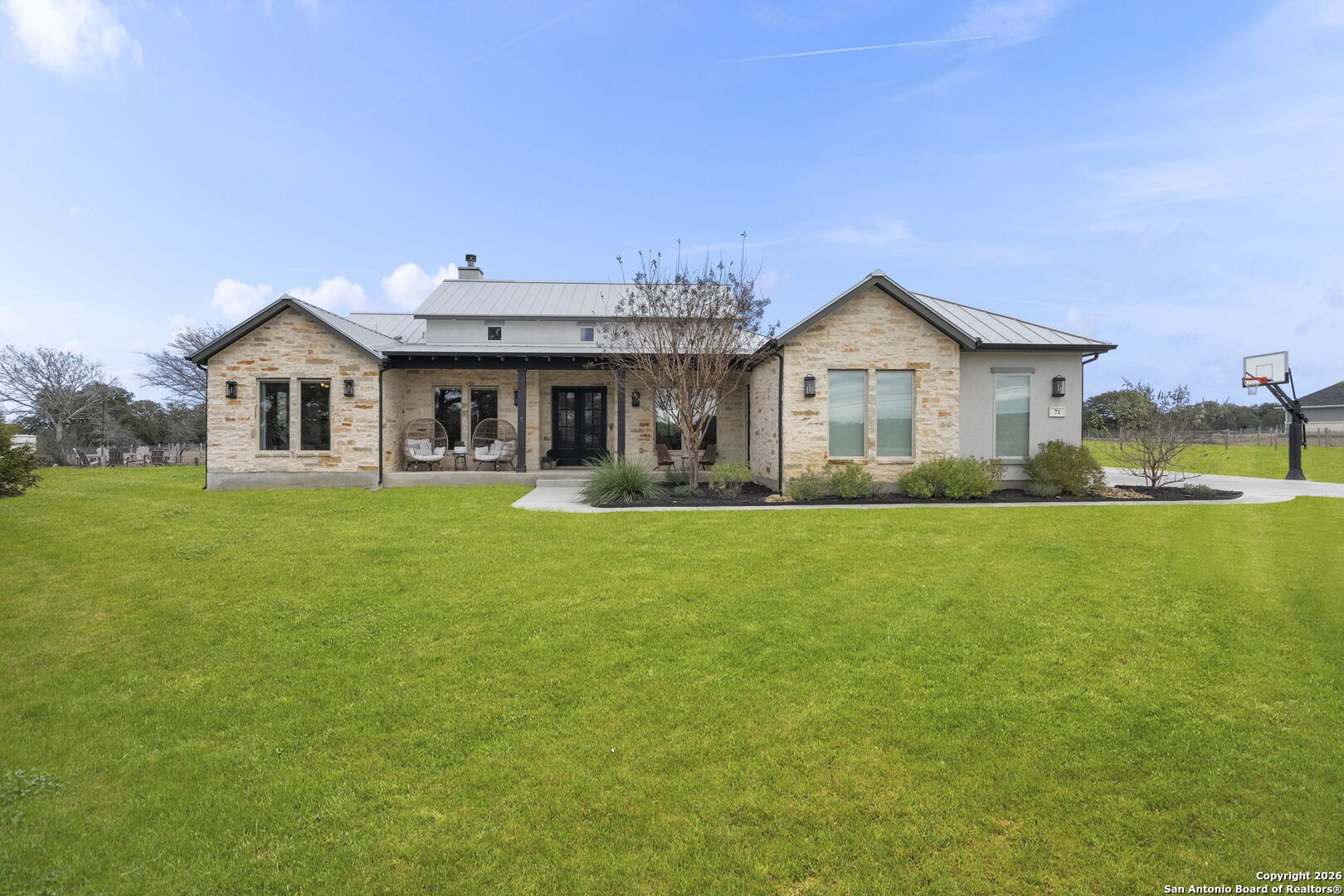 71 Sabinas Creek Ranch Road Boerne, TX 78006 - Photo 2 of 38 a front view of house with yard and green space