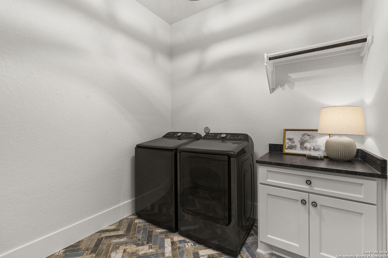 71 Sabinas Creek Ranch Road Boerne, TX 78006 - Photo 21 of 38 a view of storage and utility room with washer and dryer