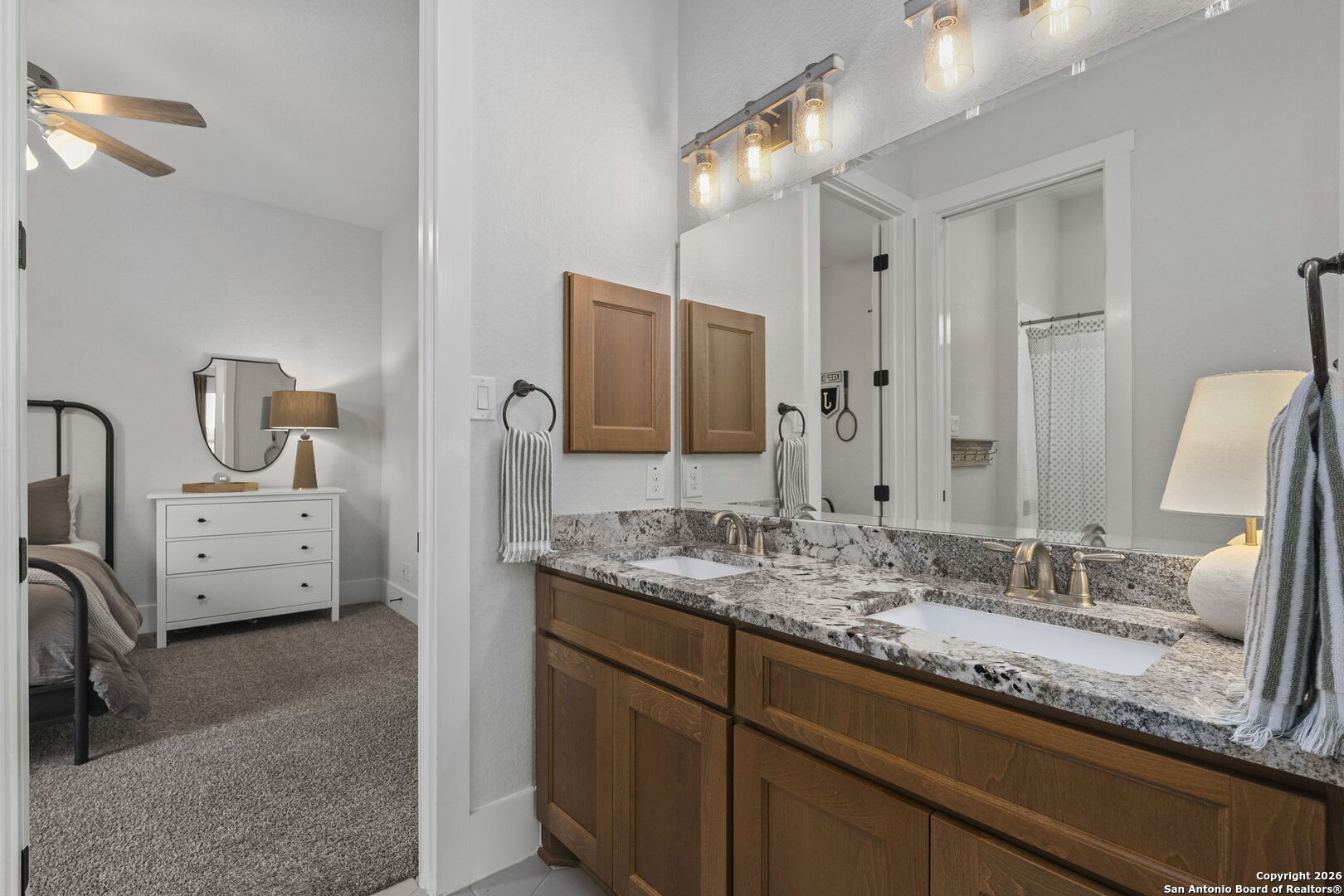 71 Sabinas Creek Ranch Road Boerne, TX 78006 - Photo 28 of 38 a bathroom with a sink and a mirror