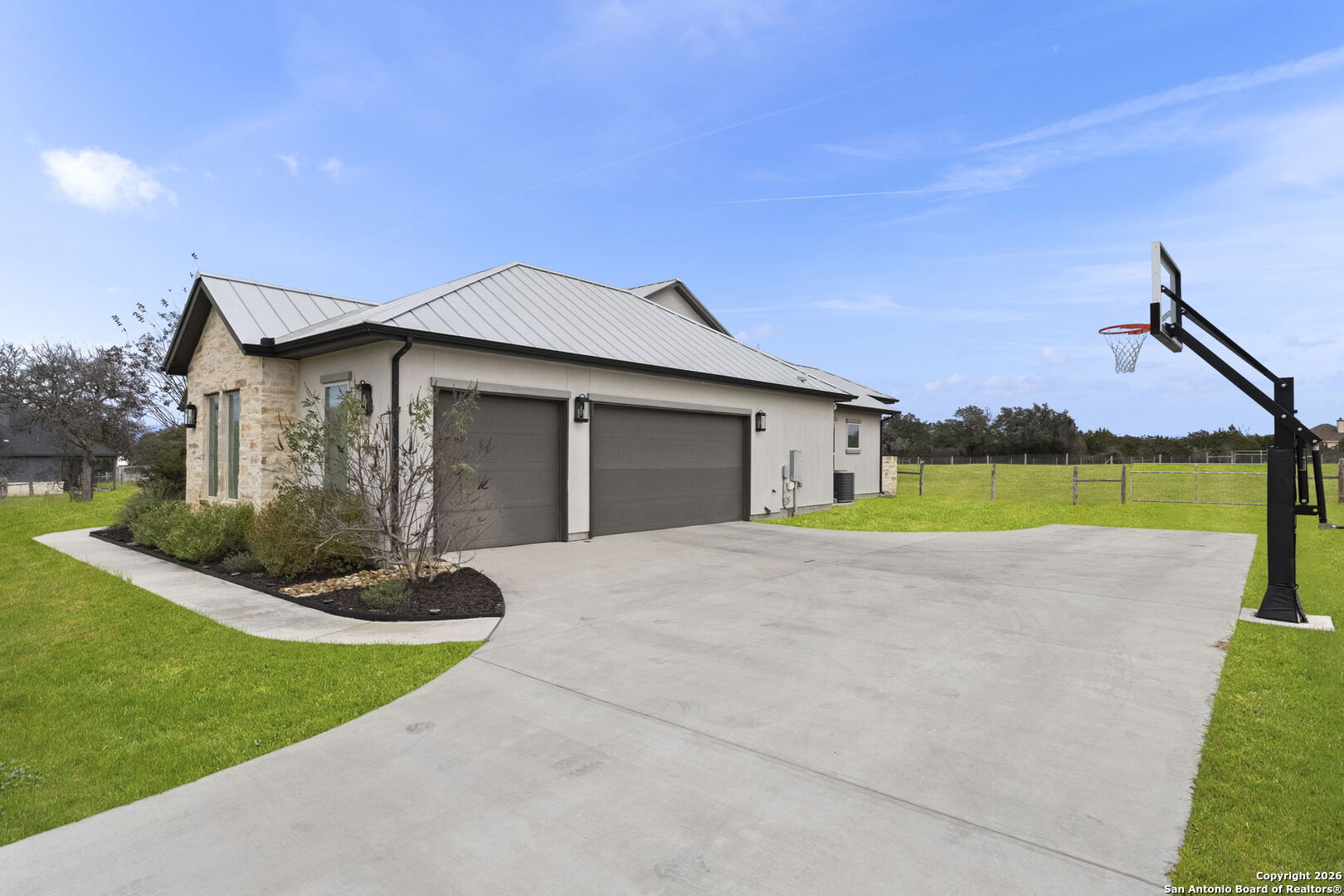 71 Sabinas Creek Ranch Road Boerne, TX 78006 - Photo 33 of 38 a house with garden in front of it