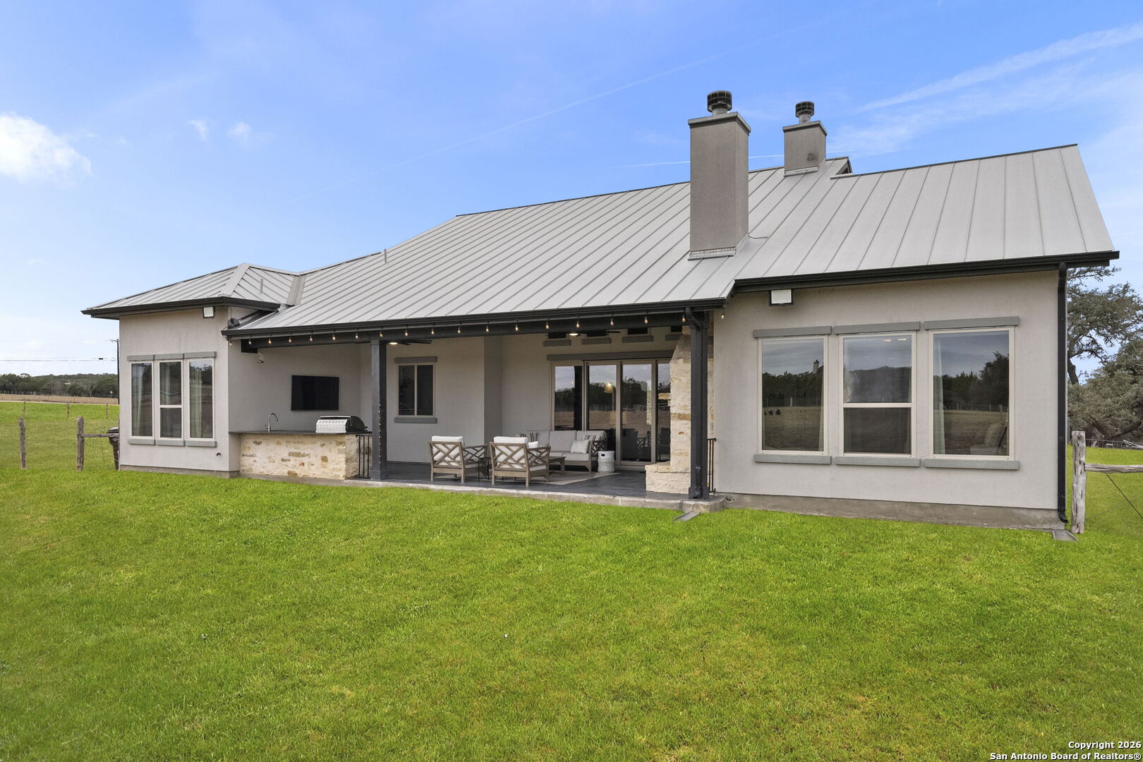 71 Sabinas Creek Ranch Road Boerne, TX 78006 - Photo 35 of 38 a front view of a house with swimming pool and porch with furniture