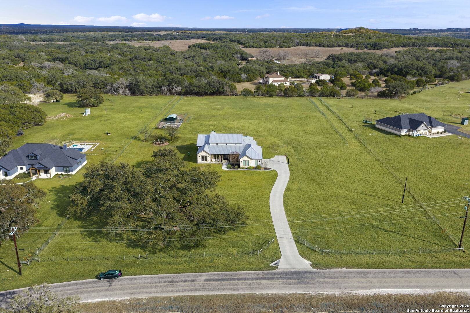 71 Sabinas Creek Ranch Road Boerne, TX 78006 - Photo 37 of 38 an aerial view of a house with a yard