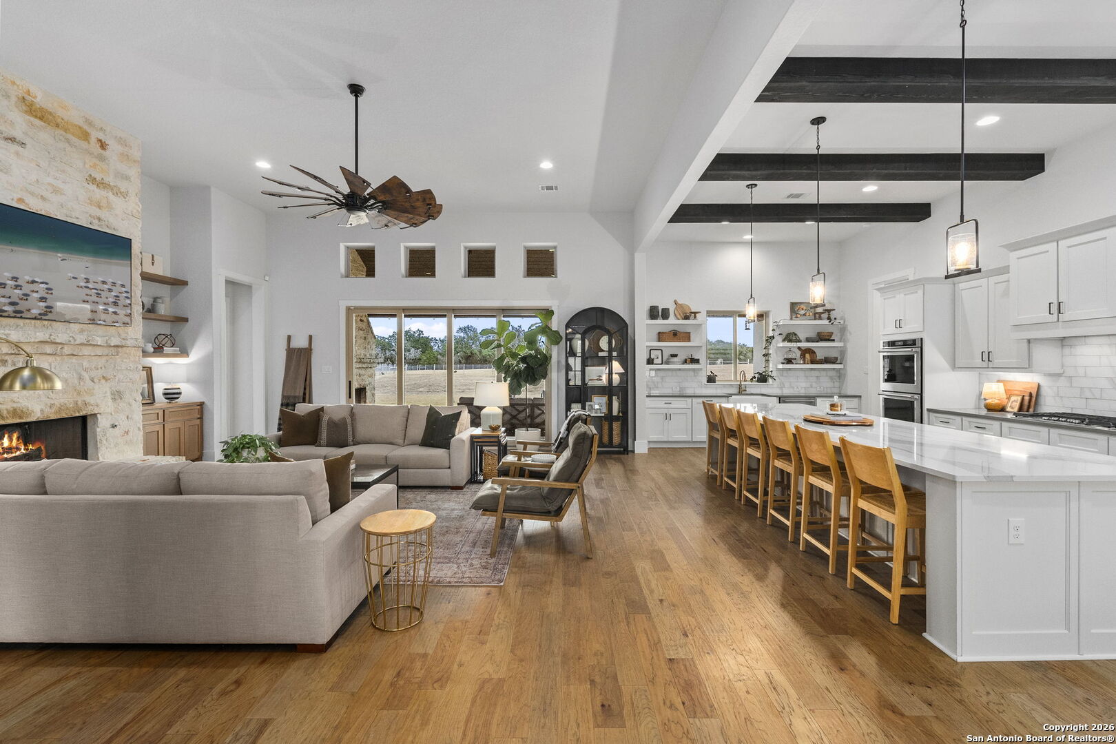 71 Sabinas Creek Ranch Road Boerne, TX 78006 - Photo 10 of 38 a living room with fireplace furniture and a large window