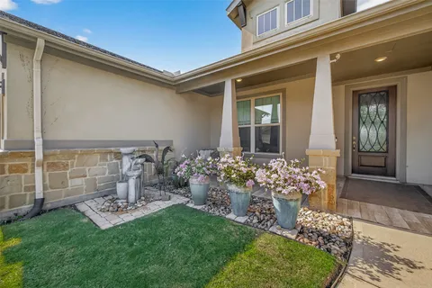 front view of a house with a garden