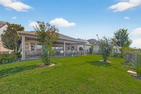 a front view of house with a garden
