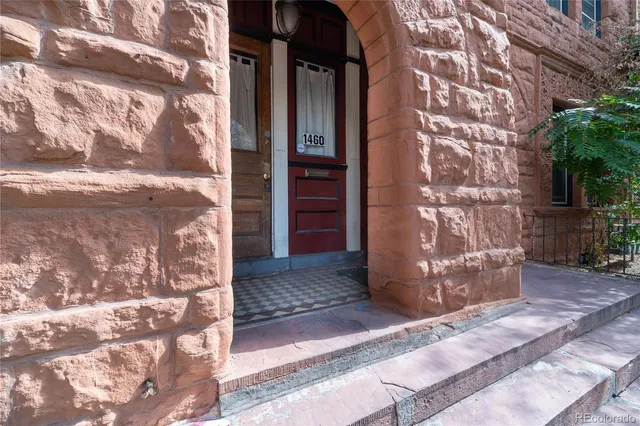 a view of a wooden door of the house