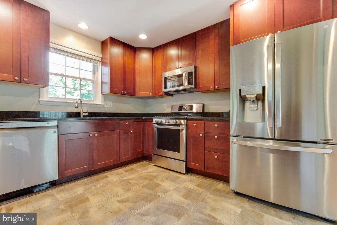 1007 Collingwood Road Alexandria, VA 22308 - Photo 9 of 26 SS appliances, granite counter tops,42 in cabinets