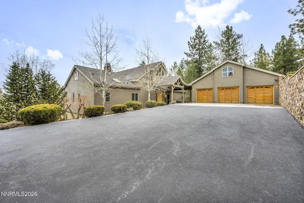 a kitchen with stainless steel appliances granite countertop a large stove a sink dishwasher and cabinets with wooden floor