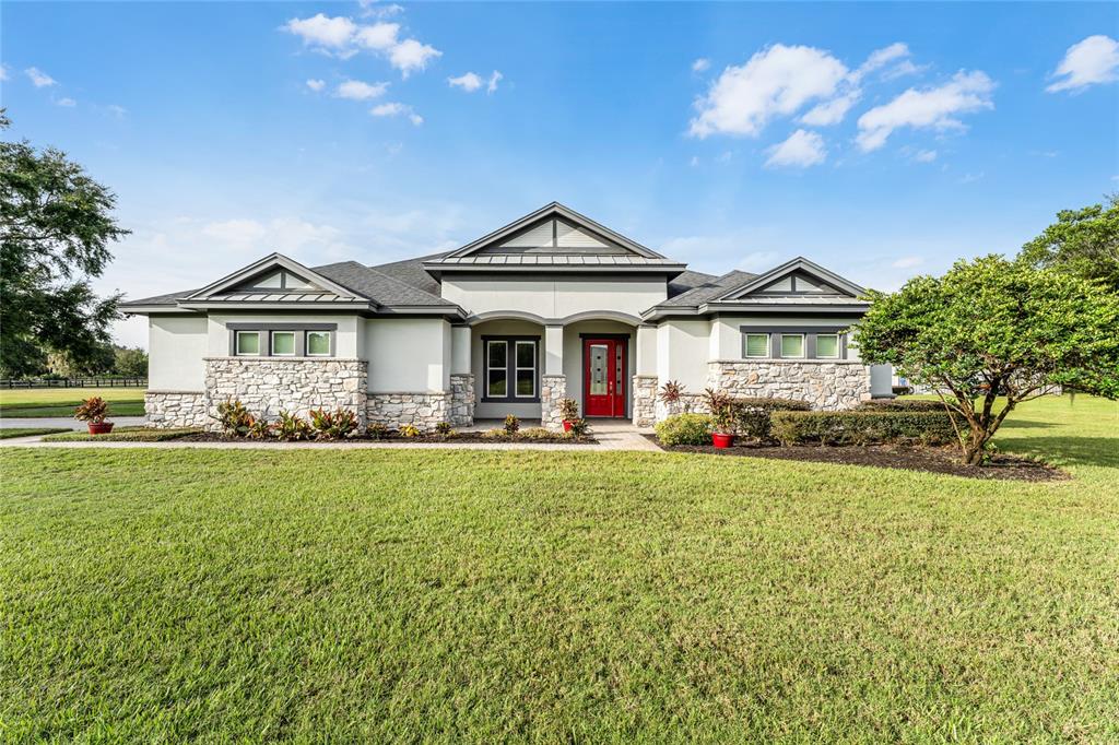 1000 Lake Harney Road Geneva, FL 32732 - Photo 1 of 1 a front view of a house with garden