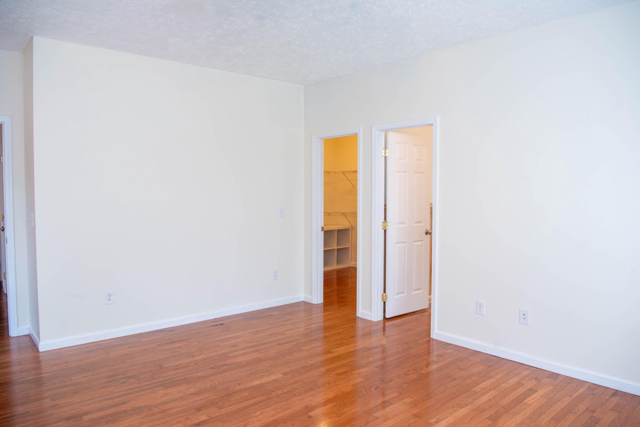 792 Forest Glen Road Moorefield, WV 26836 - Photo 75 of 146 Spacious ensuite bedroom with warm wood floors.