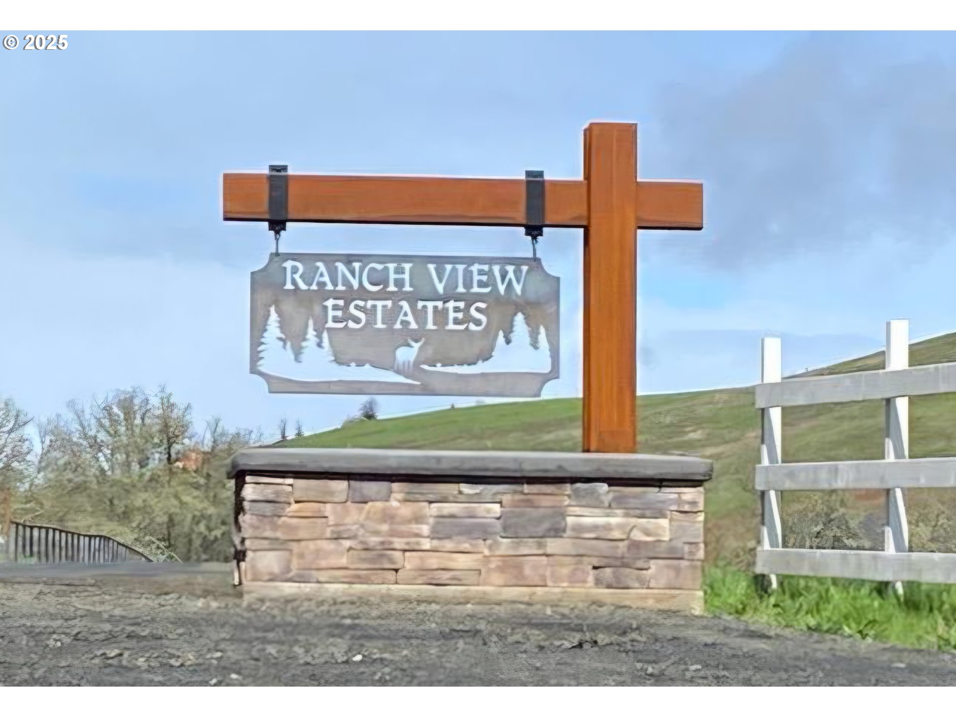 359 Ladybug Lane Roseburg, OR 97470 - Photo 2 of 13 a street sign on a pole on a street