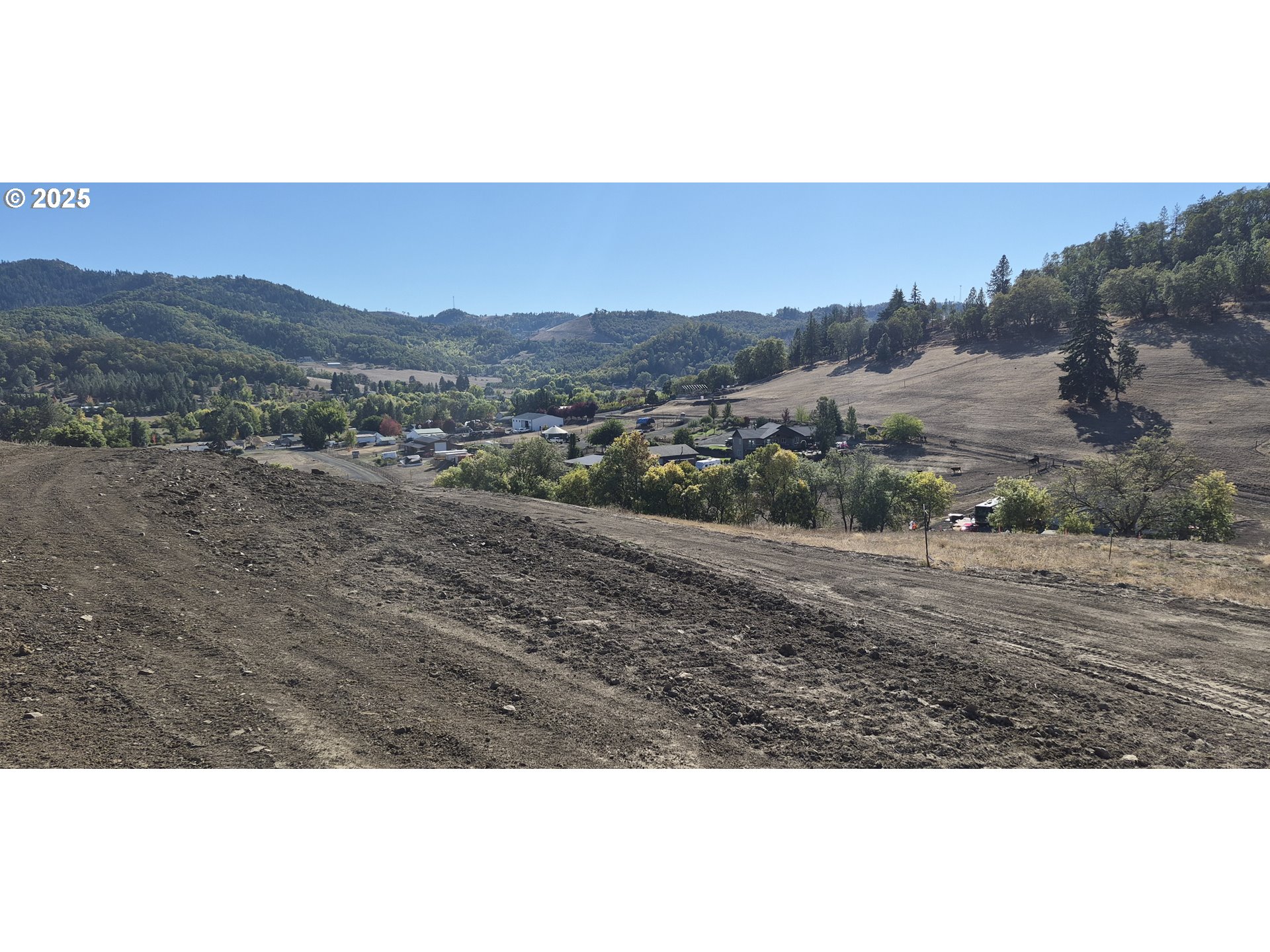 359 Ladybug Lane Roseburg, OR 97470 - Photo 4 of 13 a view of an outdoor space and mountain view