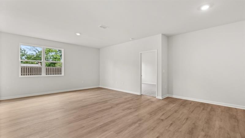 29 Coggins Place Northeast Rome, GA 30165 - Photo 11 of 41 an empty room with wooden floor and windows