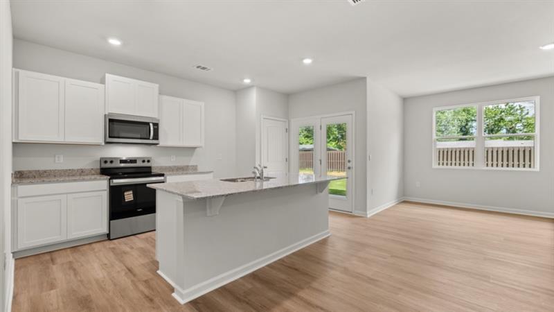 29 Coggins Place Northeast Rome, GA 30165 - Photo 5 of 41 a kitchen with a stove a sink and a microwave