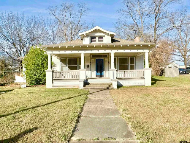 a front view of a house with a outdoor space