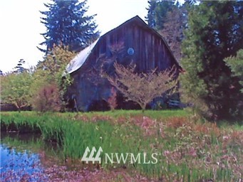 -xxx Erickson Road Southwest Longbranch, WA 98351 - Photo 1 of 1 a backyard of a house with lots of green space