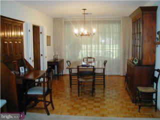 1421 Holcomb Road Huntingdon Valley, PA 19006 - Photo 2 of 5 a dining room with furniture a chandelier and wooden floor