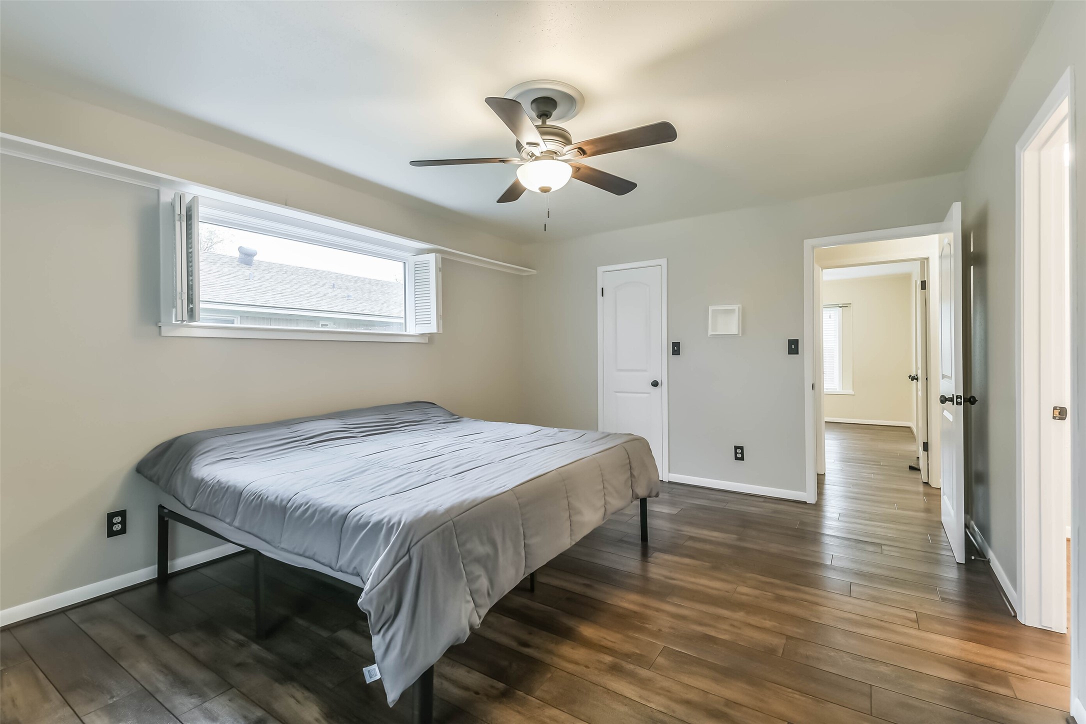 1210 Timber Lane Rosenberg, TX 77471 - Photo 23 of 48 a bedroom with a bed and wooden floor