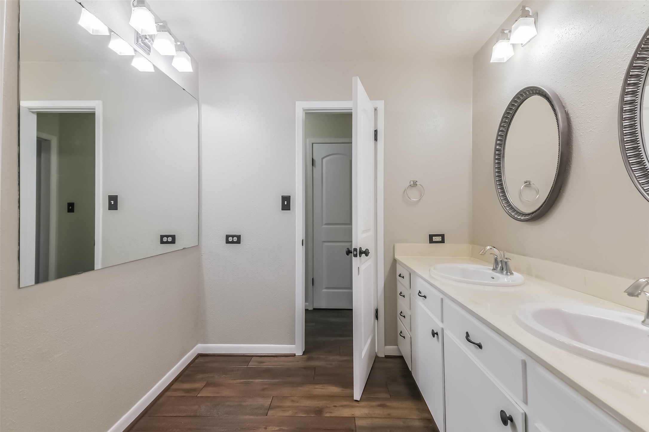 1210 Timber Lane Rosenberg, TX 77471 - Photo 25 of 48 a bathroom with a double vanity sink and a mirror