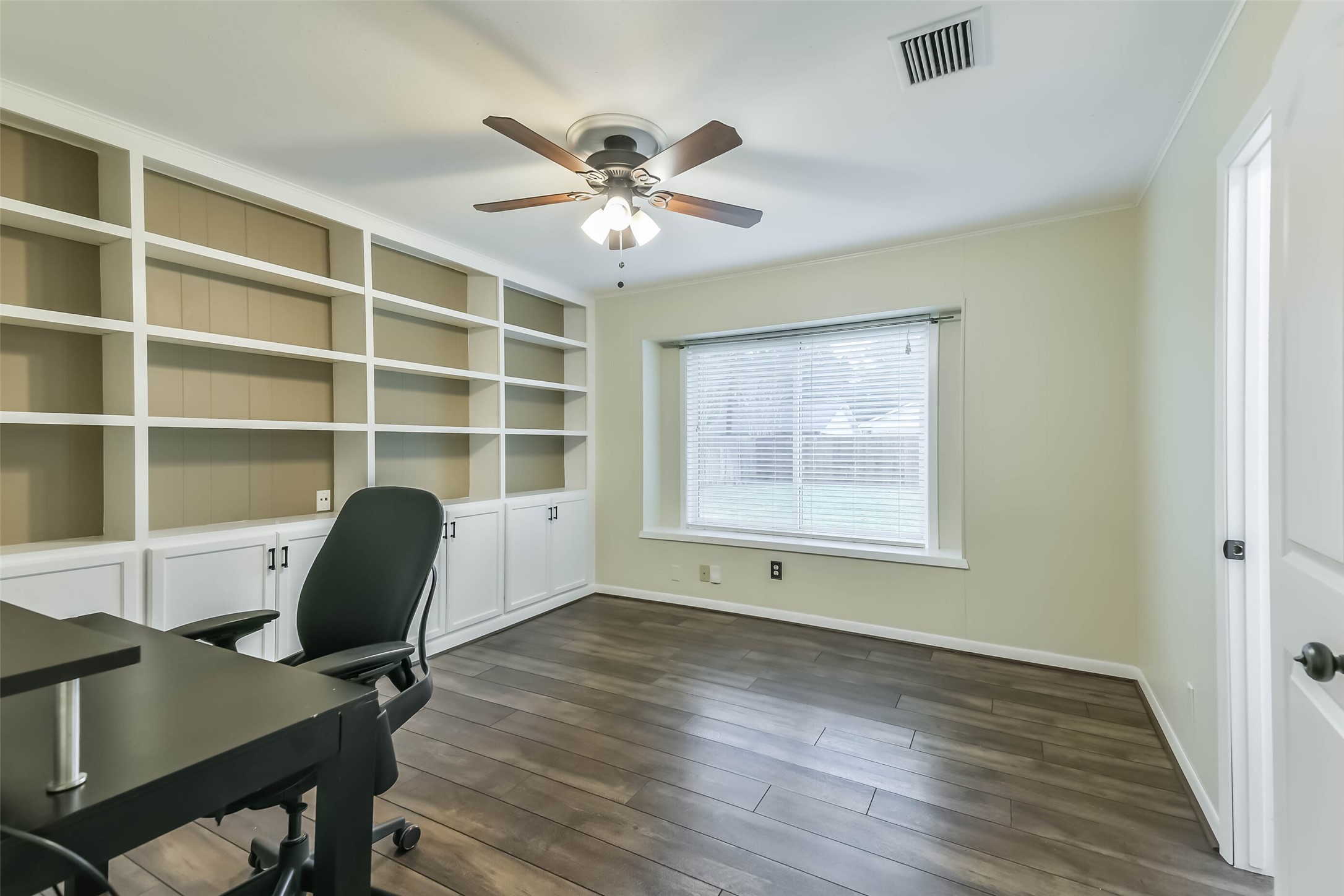 1210 Timber Lane Rosenberg, TX 77471 - Photo 27 of 48 a view of a workspace with furniture and a window