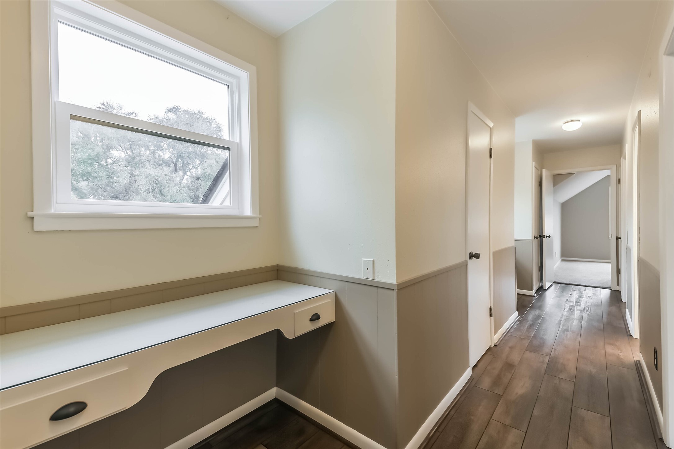 1210 Timber Lane Rosenberg, TX 77471 - Photo 30 of 48 a view of hallway with a large window and wooden floor