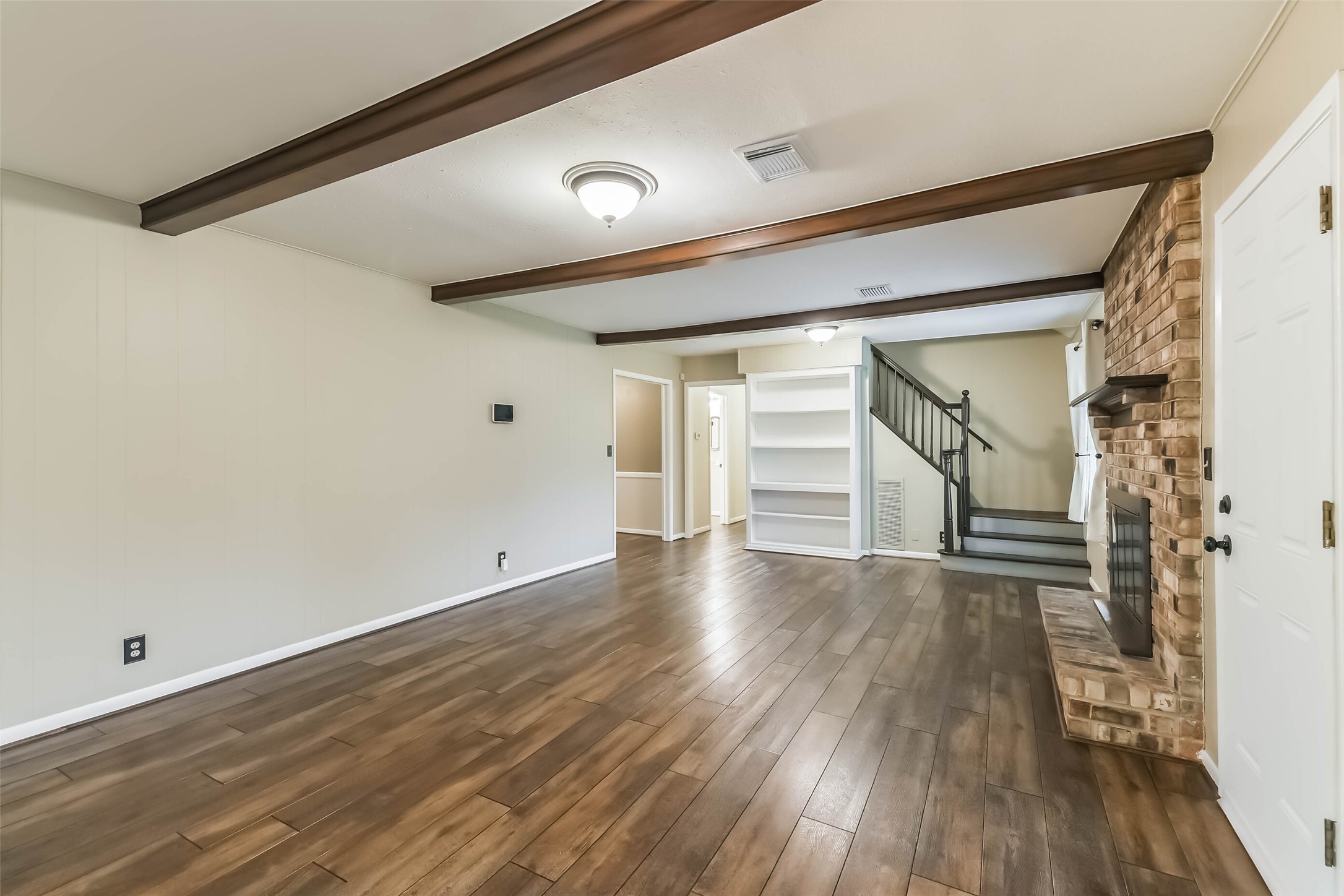 1210 Timber Lane Rosenberg, TX 77471 - Photo 4 of 48 a view of empty room with wooden floor and fan