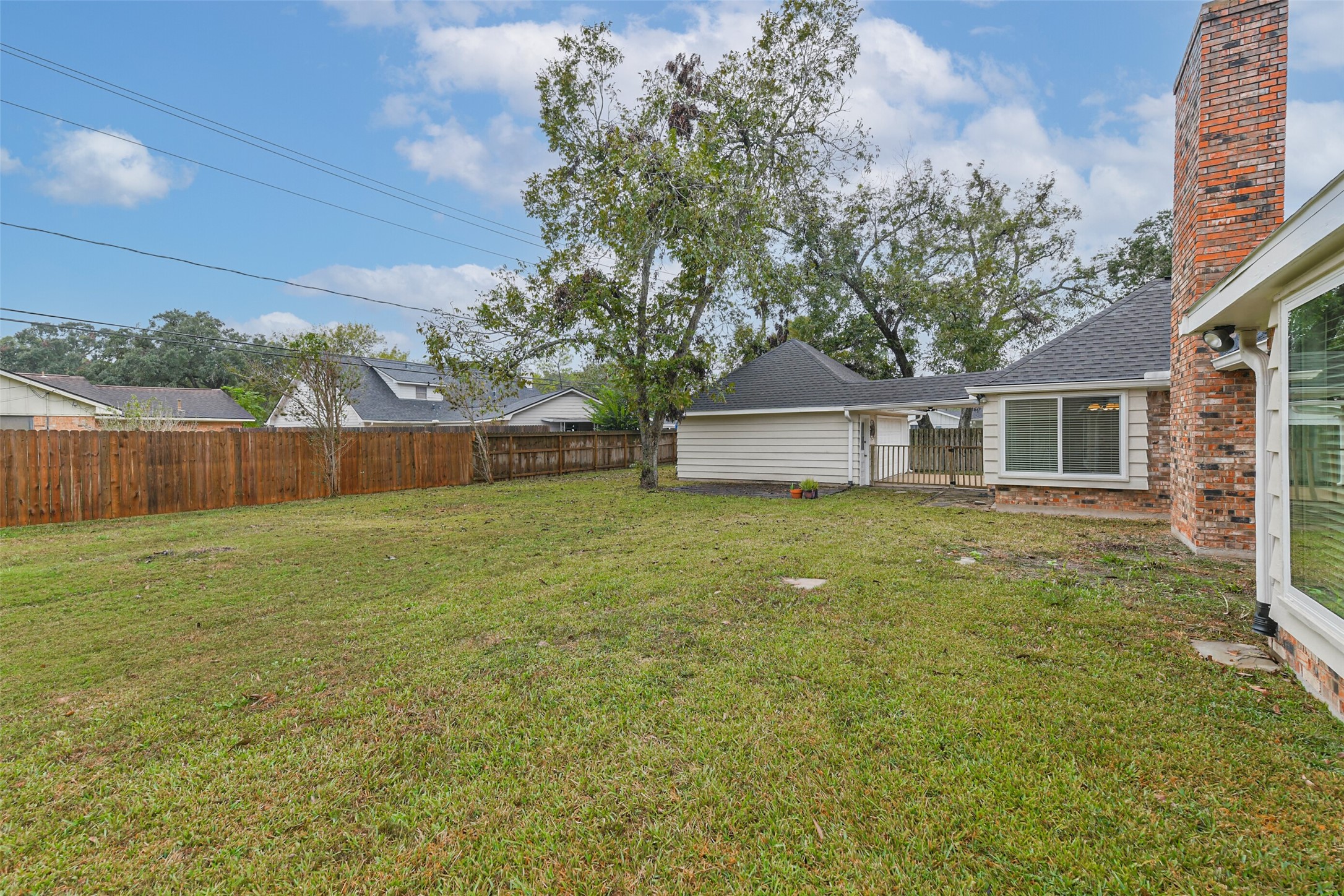 1210 Timber Lane Rosenberg, TX 77471 - Photo 42 of 48 a front view of house with yard and trees in the background