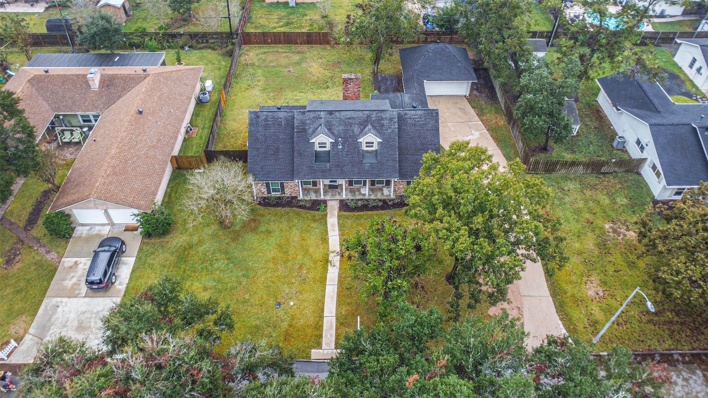 1210 Timber Lane Rosenberg, TX 77471 - Photo 46 of 48 an aerial view of a house with a garden and a yard