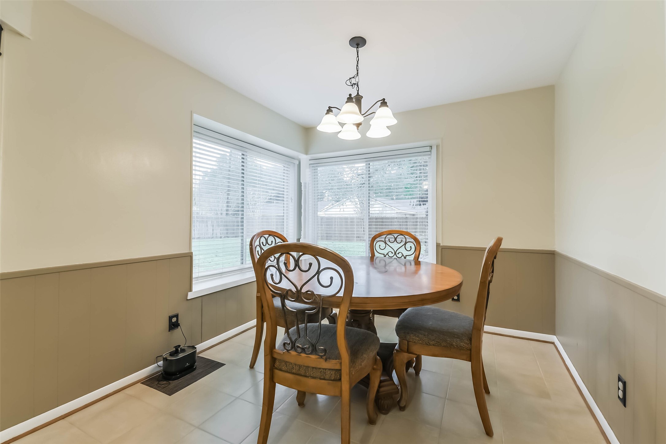 1210 Timber Lane Rosenberg, TX 77471 - Photo 7 of 48 a view of a dining room with furniture and a chandelier
