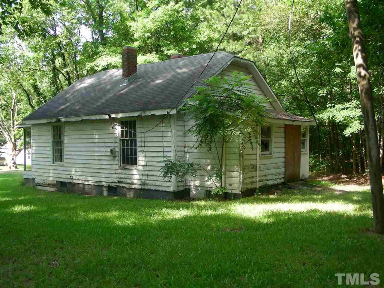 3012 Burrell Place Raleigh, NC 27607 - Photo 3 of 6 a backyard of a house with table and chairs