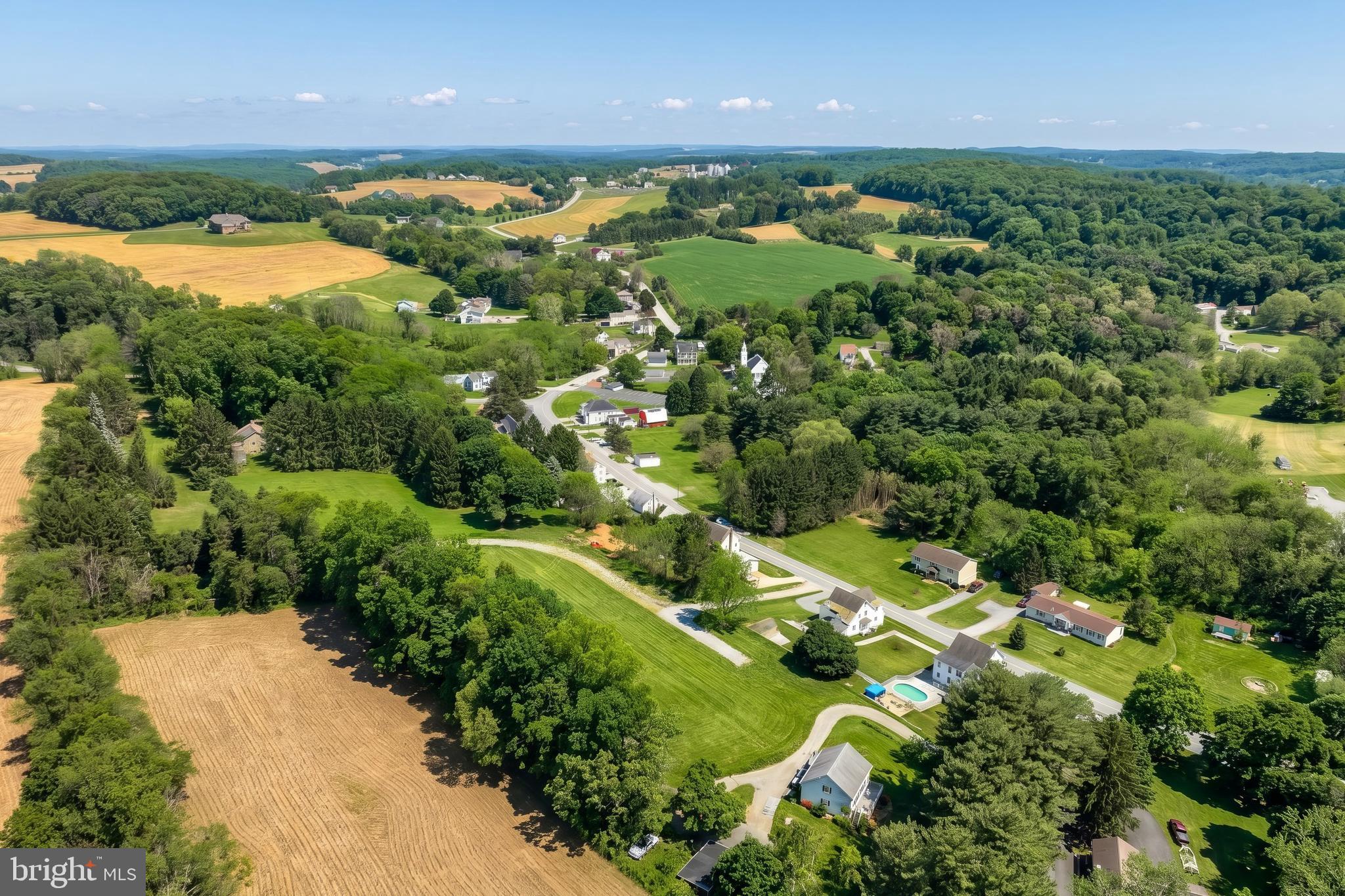 361 Springvale Road Red Lion, PA 17356 - Photo 10 of 14 an aerial view of green landscape with trees houses and lake view
