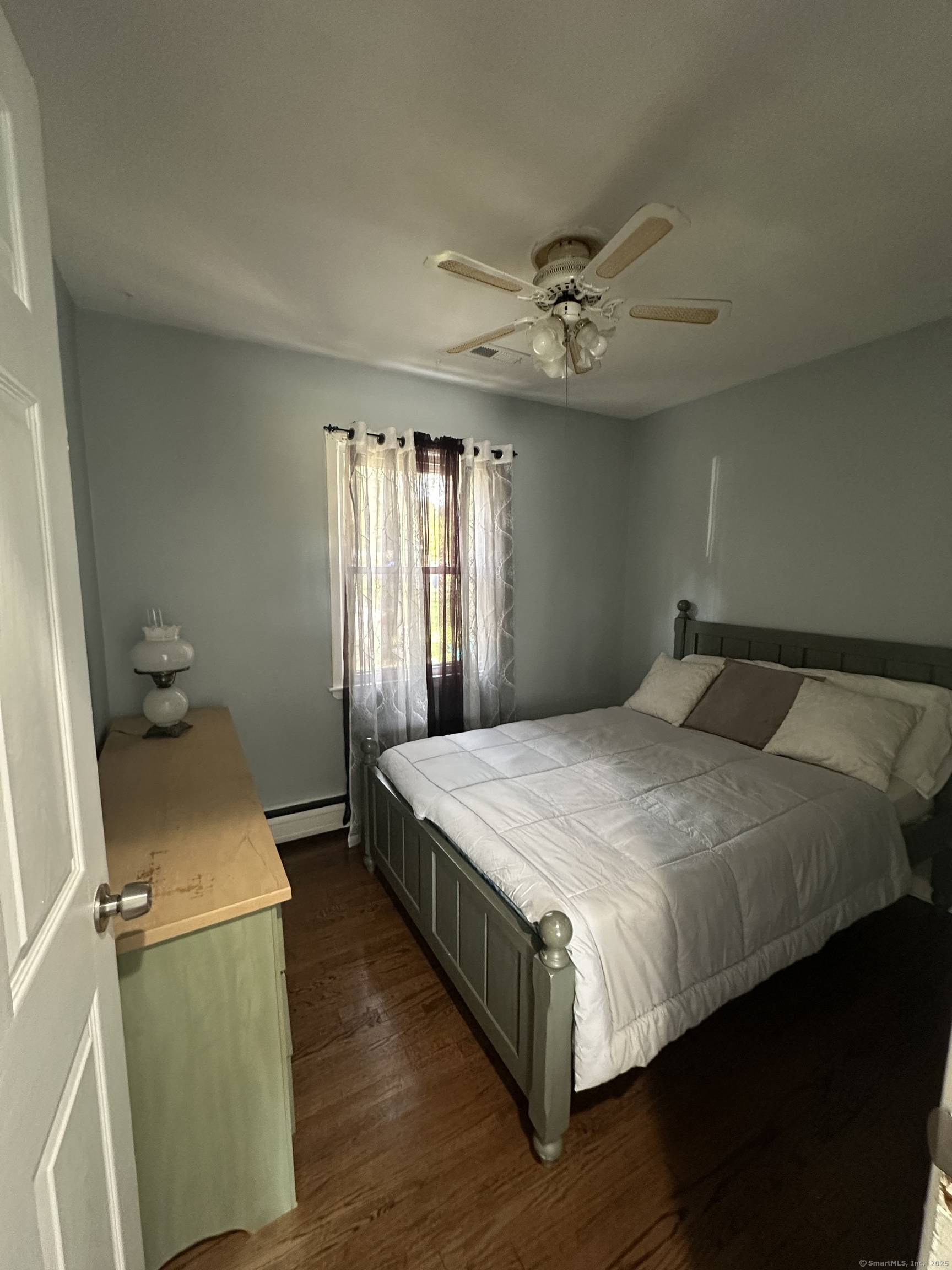 196 Monroe Street Milford, CT 06460 - Photo 16 of 31 a bedroom with a bed and window