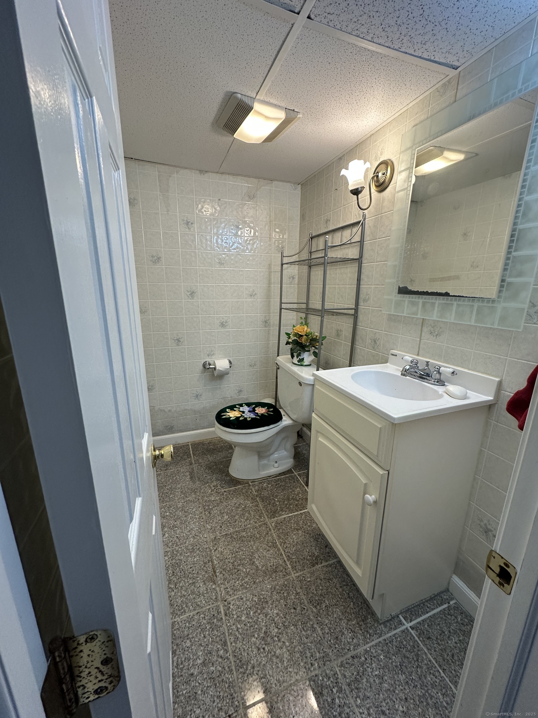 196 Monroe Street Milford, CT 06460 - Photo 22 of 31 a bathroom with a sink toilet and mirror