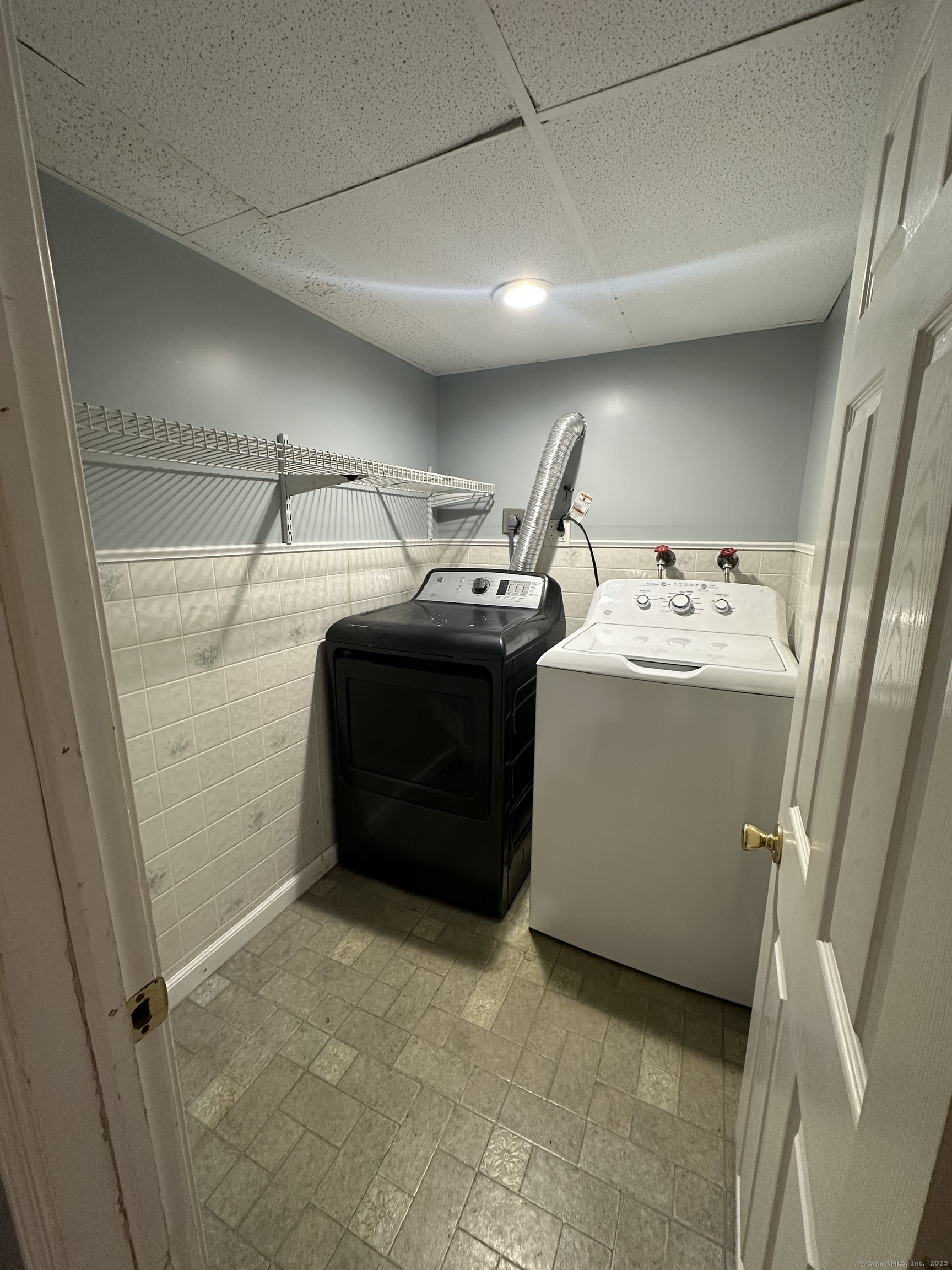 196 Monroe Street Milford, CT 06460 - Photo 23 of 31 a utility room with dryer and washer